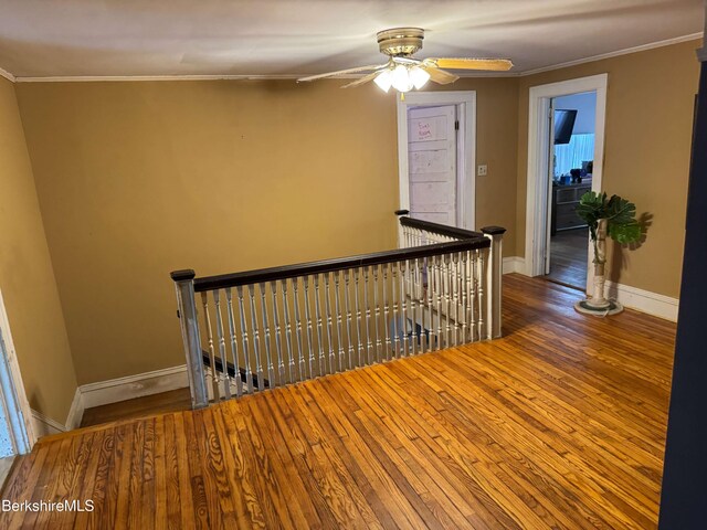145 Bartlett Ave, Pittsfield, MA 01201 - stairs featuring ornamental molding, wood finished floors, a ceiling fan, and baseboards