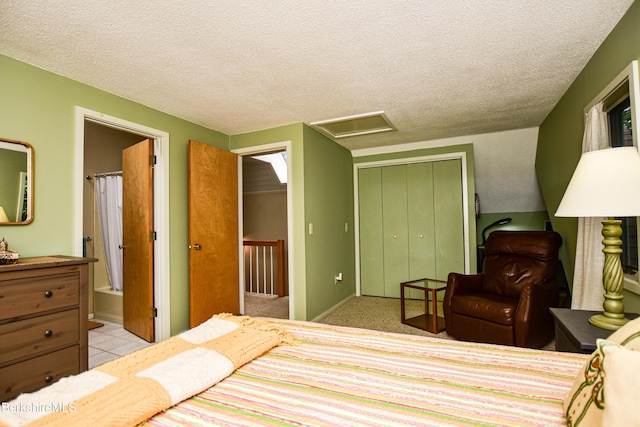 345 Big Bass Ln, Becket, MA 01223 - bedroom with attic access, a closet, a textured ceiling, and ensuite bath