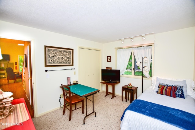 345 Big Bass Ln, Becket, MA 01223 - bedroom featuring track lighting, a closet, and a textured ceiling
