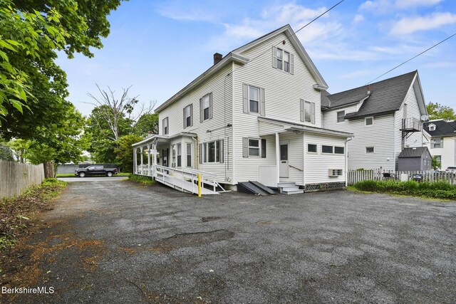 232 First St, Pittsfield, MA 01201 - rear view of property with a chimney and entry steps
