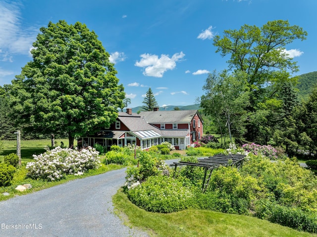 view of front of home with a pergola