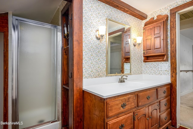 bathroom featuring vanity and an enclosed shower