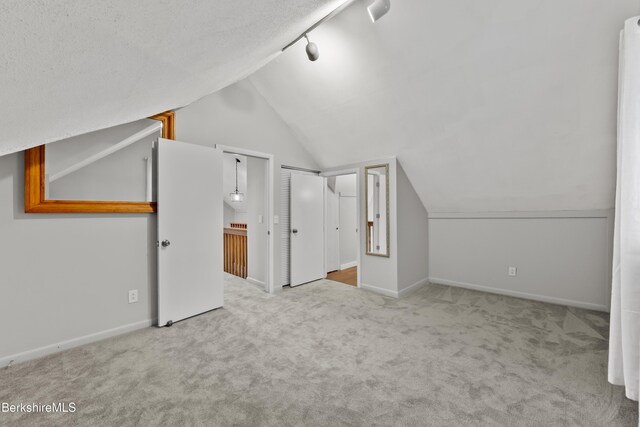 94 Corey Rd Unit D, Hancock, MA 01237 - bonus room featuring carpet floors, vaulted ceiling, and baseboards