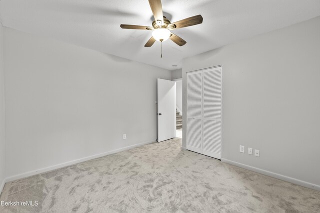 94 Corey Rd Unit D, Hancock, MA 01237 - unfurnished bedroom with carpet, baseboards, a closet, and a ceiling fan