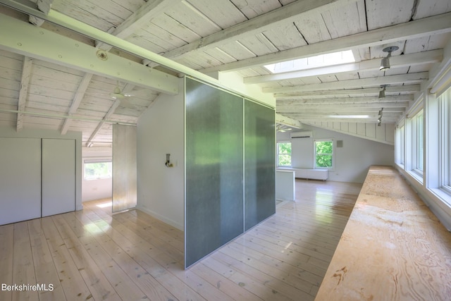 corridor with vaulted ceiling with beams, wooden ceiling, a wall mounted AC, and light hardwood / wood-style flooring