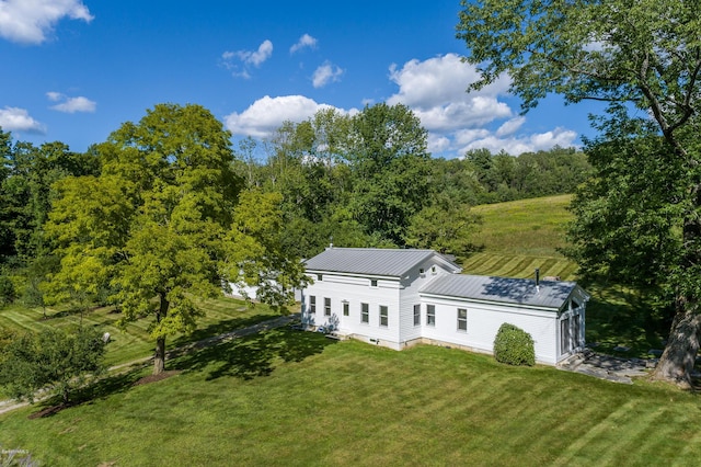 birds eye view of property with a rural view