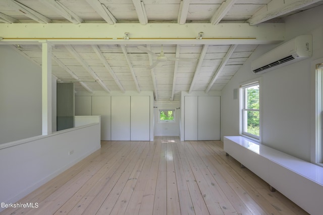 bonus room with a wall unit AC, lofted ceiling with beams, wooden ceiling, and light wood-type flooring