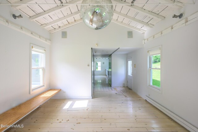 hallway featuring beam ceiling, light hardwood / wood-style floors, a baseboard heating unit, and wooden ceiling