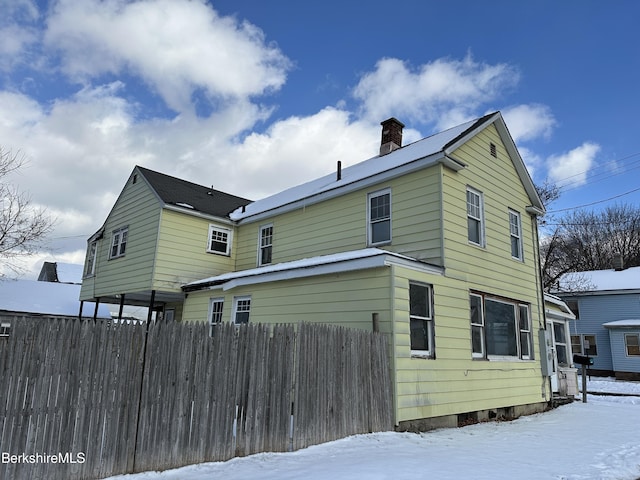 view of snow covered house