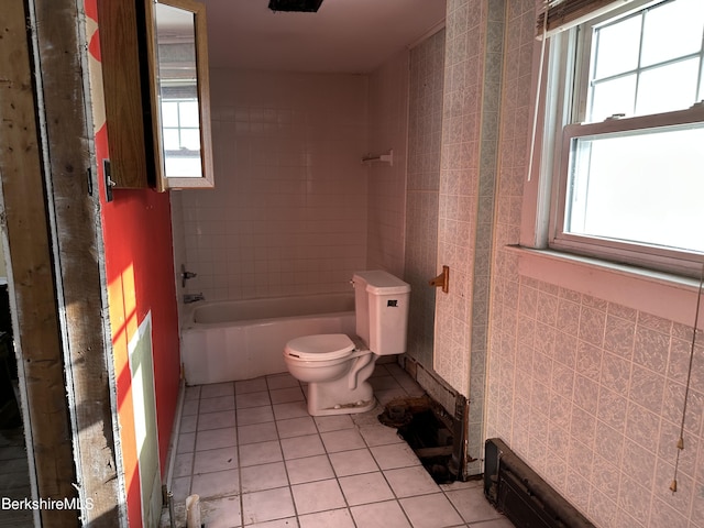 bathroom with tile patterned flooring and toilet