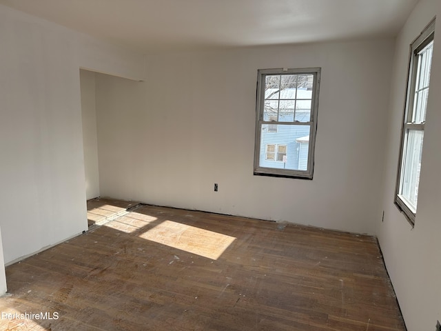 unfurnished room with dark hardwood / wood-style floors