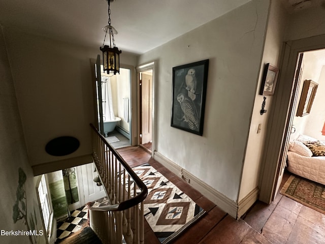 3 Swamp Rd, West Stockbridge, MA 01266 - staircase with a chandelier, hardwood / wood-style flooring, baseboards, and plenty of natural light