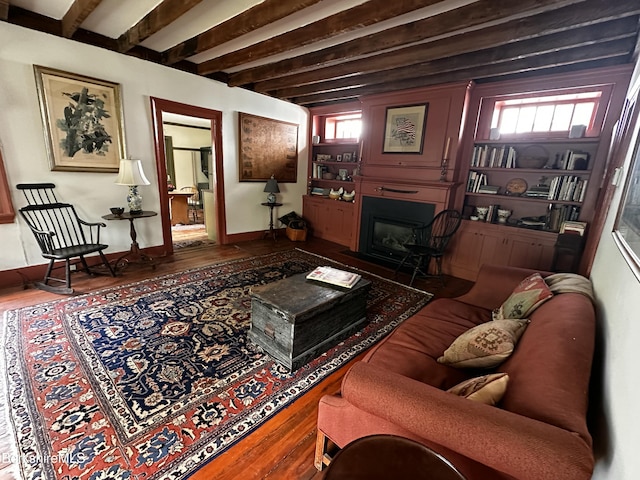 3 Swamp Rd, West Stockbridge, MA 01266 - living area with a glass covered fireplace, wood finished floors, and beam ceiling