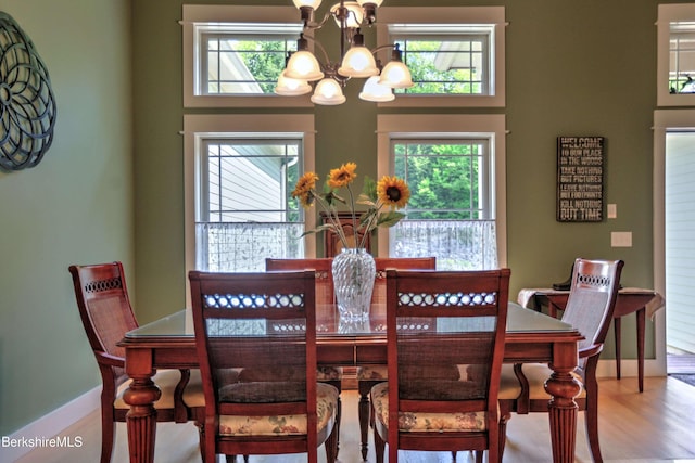 7 Perry Rd, Sandisfield, MA 01255 - dining room featuring a chandelier, healthy amount of natural light, and wood finished floors