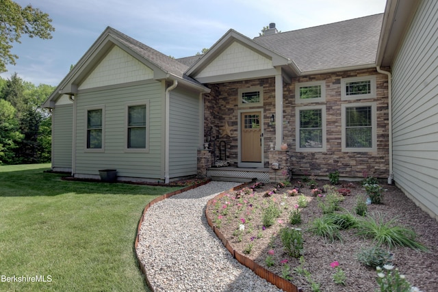 7 Perry Rd, Sandisfield, MA 01255 - view of front facade with a front yard, stone siding, roof with shingles, and a chimney