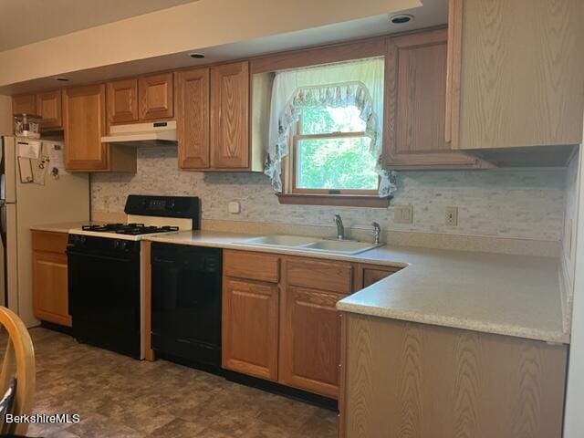 kitchen featuring white appliances and sink