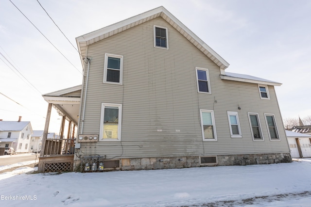 view of snow covered house