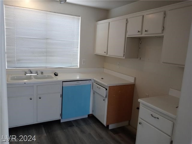 kitchen with stainless steel dishwasher, dark hardwood / wood-style floors, sink, and white cabinets