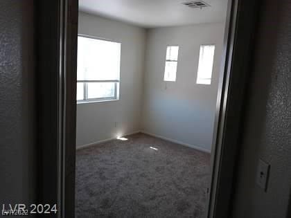 spare room with carpet flooring