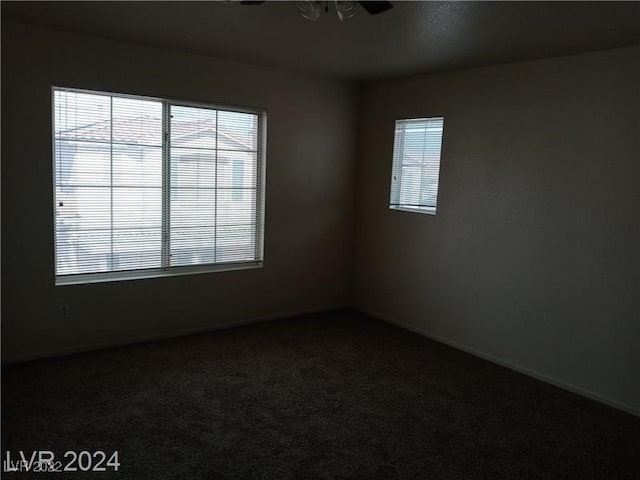 unfurnished room with carpet and ceiling fan