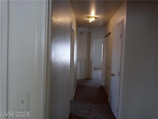 corridor with carpet floors