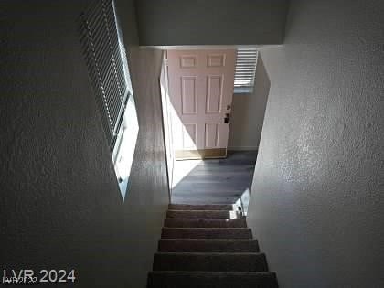 staircase featuring hardwood / wood-style floors