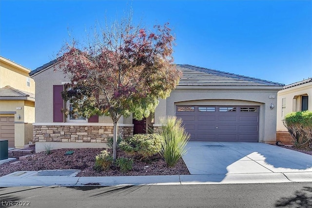 10419 Bush Mountain Ave, Las Vegas, NV 89166 - view of front facade with a garage