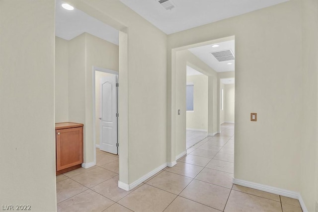 hallway with light tile floors