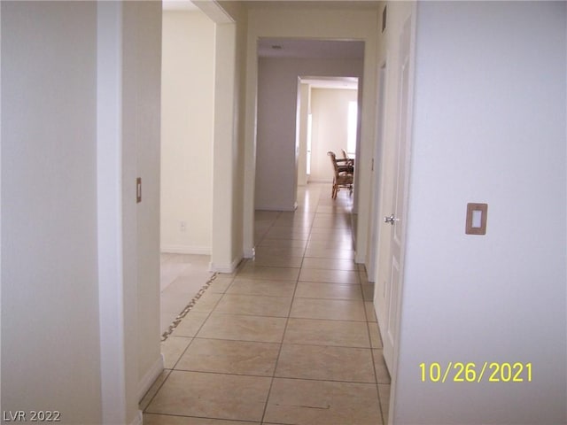 hallway with light tile flooring