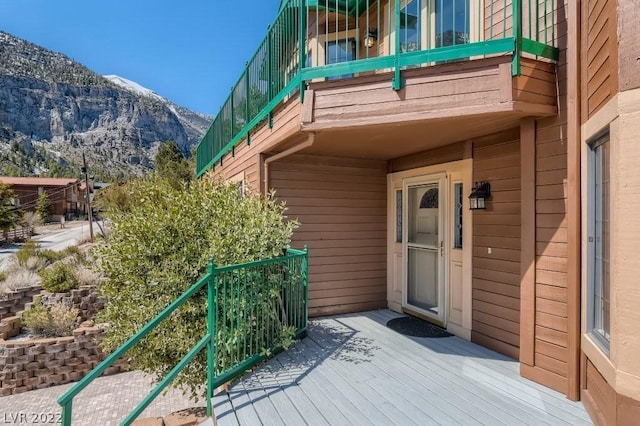 entrance to property featuring a mountain view and a balcony