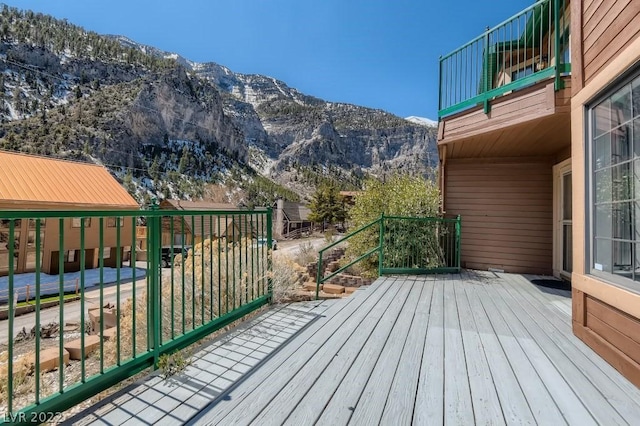 wooden deck with a mountain view