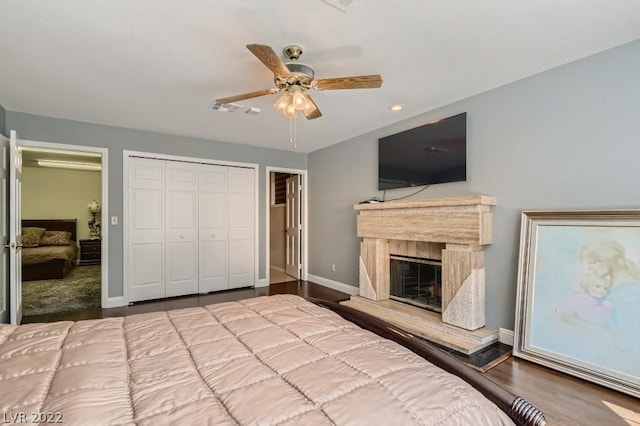 unfurnished bedroom featuring light colored carpet, ceiling fan, and a closet