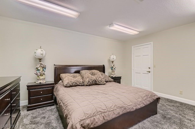 bedroom featuring dark carpet