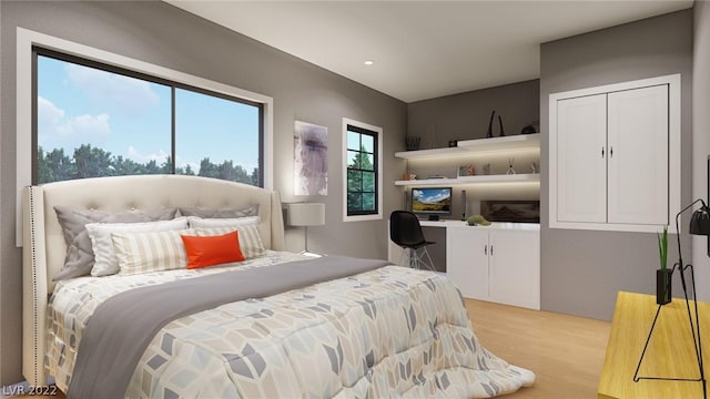 bedroom featuring a closet and light wood-type flooring