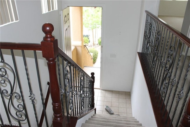 staircase with tile floors