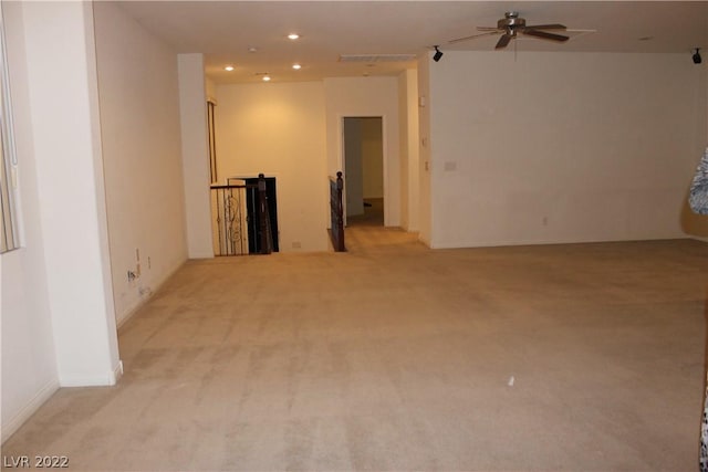 carpeted empty room with ceiling fan