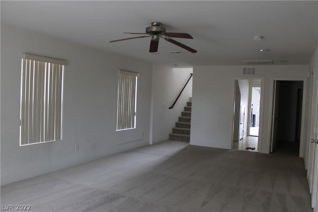 carpeted empty room with ceiling fan