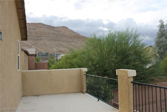 balcony featuring a mountain view