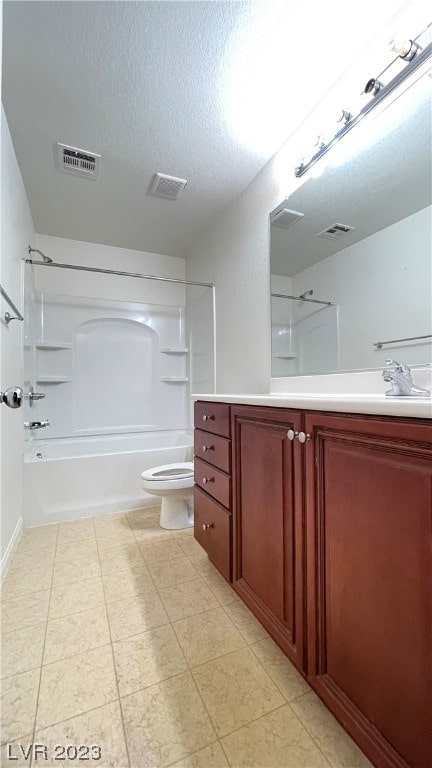 full bathroom featuring tile flooring, toilet, oversized vanity, and shower / bath combination