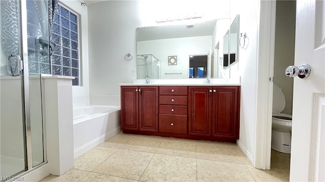 full bathroom with double sink vanity, toilet, tile floors, and independent shower and bath