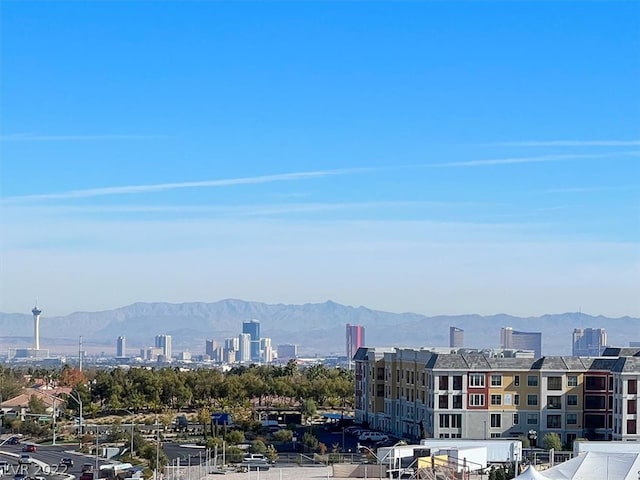 property's view of city with a mountain view