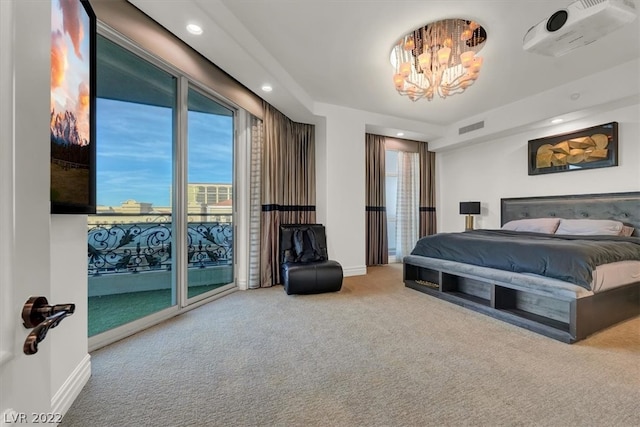 bedroom with a chandelier, access to exterior, and light colored carpet