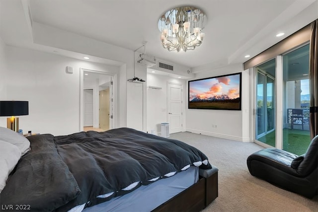 carpeted bedroom featuring access to outside and a chandelier