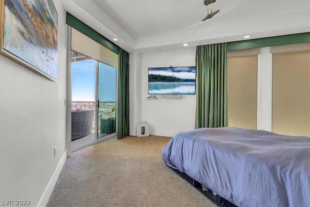 bedroom featuring light carpet and access to exterior