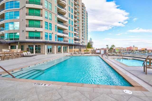 view of swimming pool with a patio