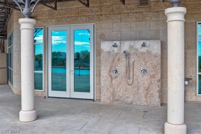 property entrance featuring french doors