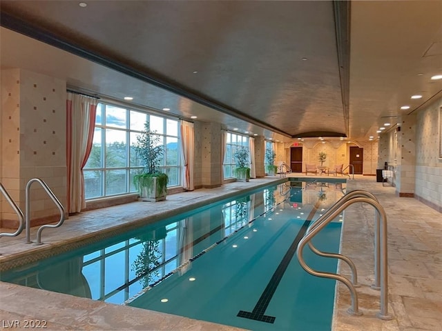 view of pool with a hot tub