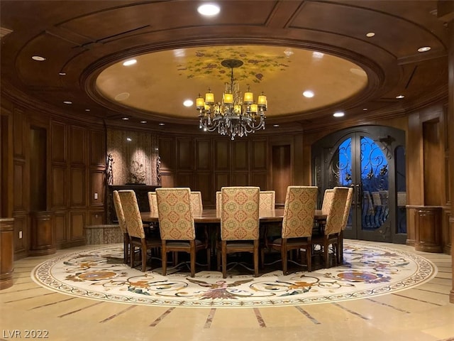 interior space with french doors, an inviting chandelier, and a tray ceiling