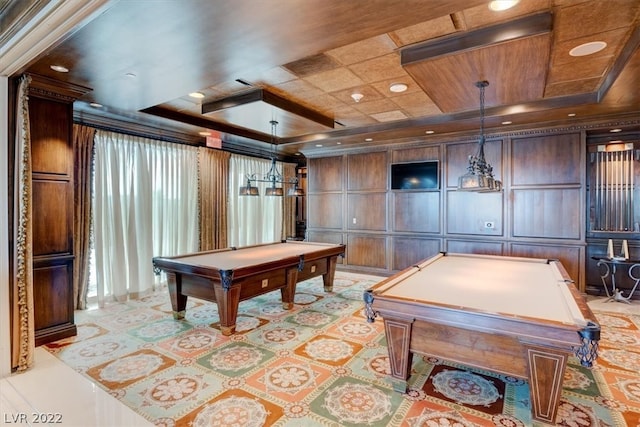 game room featuring a raised ceiling and pool table