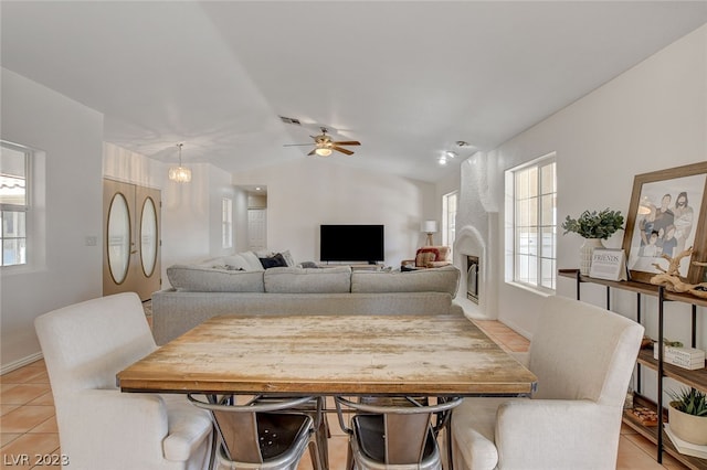 dining area with ceiling fan and light tile patterned flooring